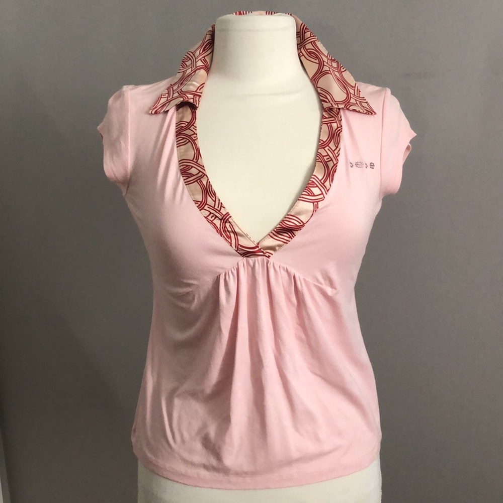 NWT.Bebe V-NK Collar top Shirt. Rhinestone Logo. Size S. Color Pink Lemonade